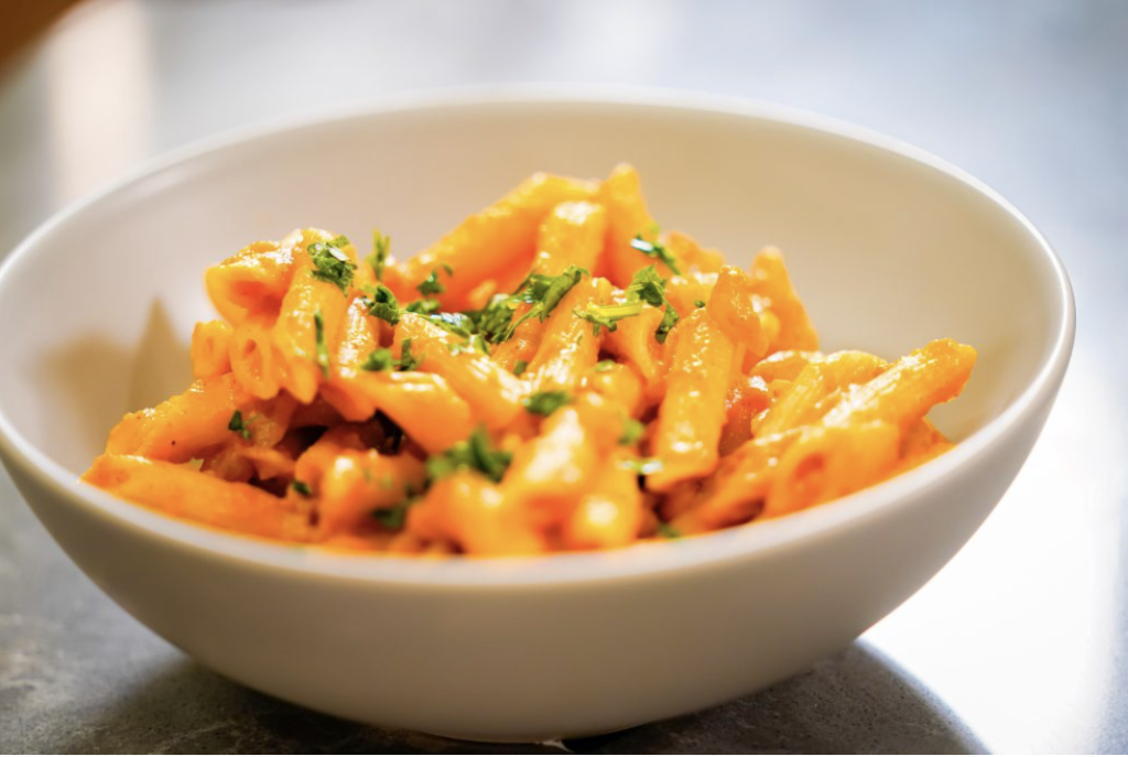 White bowl full of a pasta dish